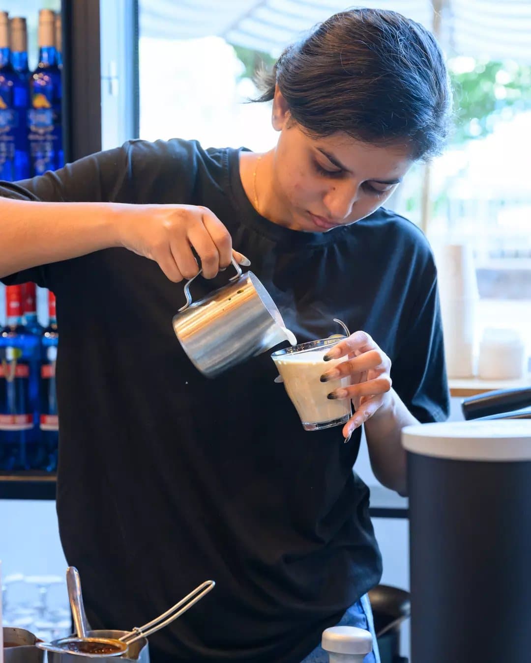 Barista pouring latte art