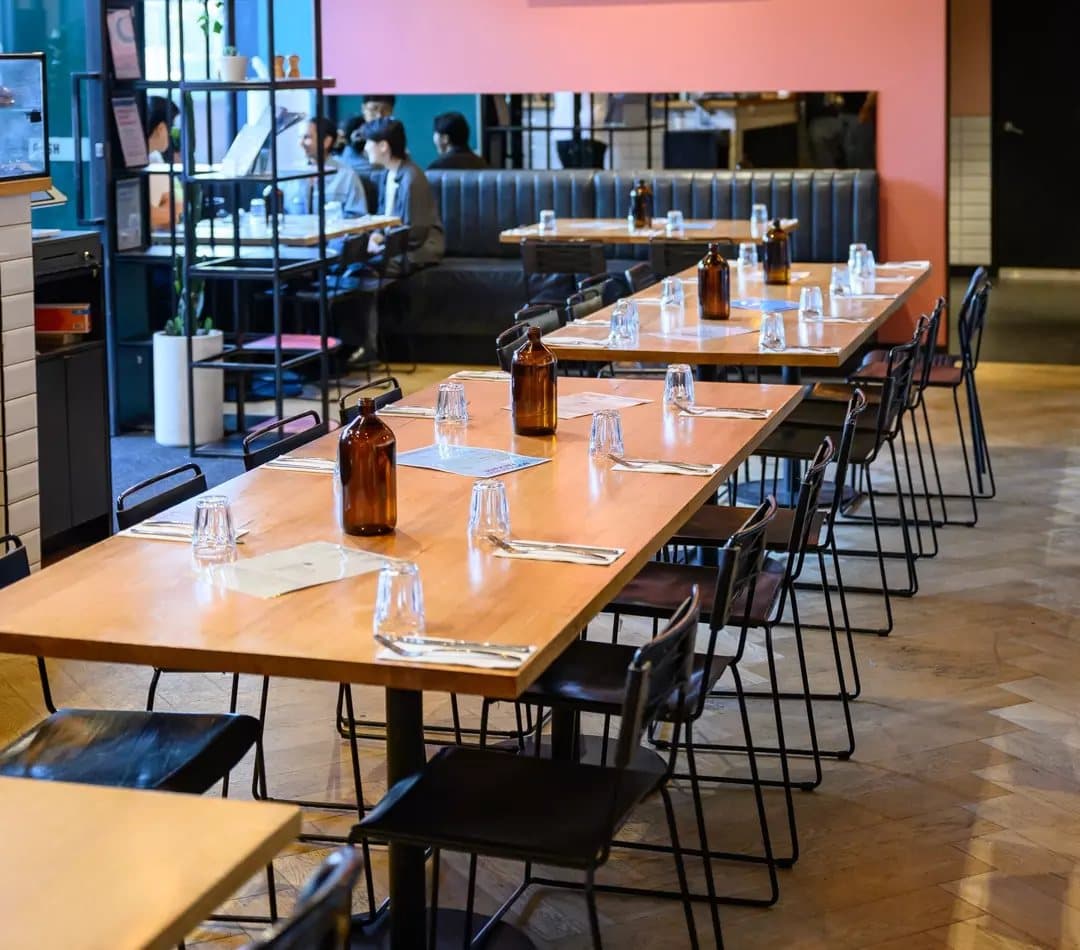 Long tables set up in the MAROO dining room